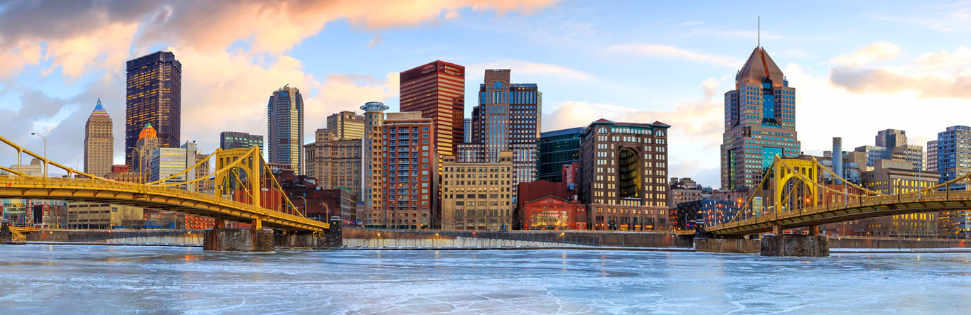 City skyline along river dark