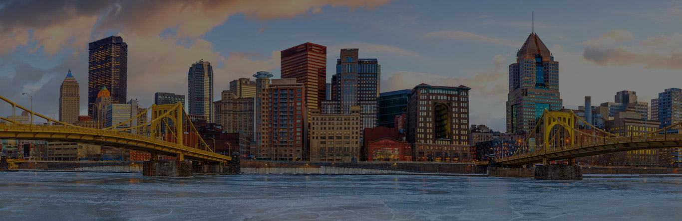 Keystone Closing main image City skyline along river dark